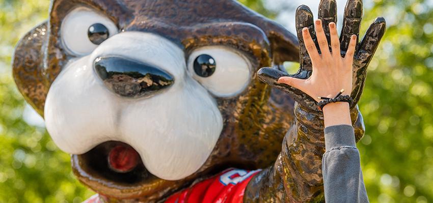 Hand high fiving Southpaw statue.