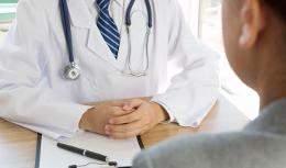 Doctor and patient at desk